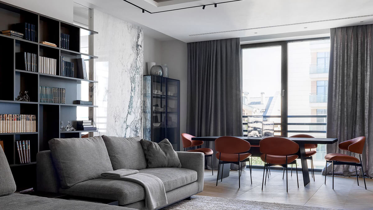 Сучасний дизайн квартири 2026 з об'єднаною кухнею та вітальнею у відкритому просторі.