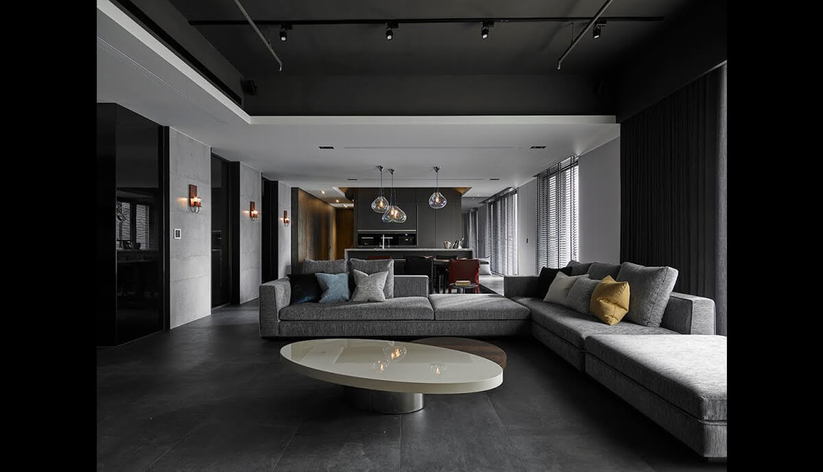 Функціональний дизайн вітальні з модульною стінкою для зберігання речей та телевізора.