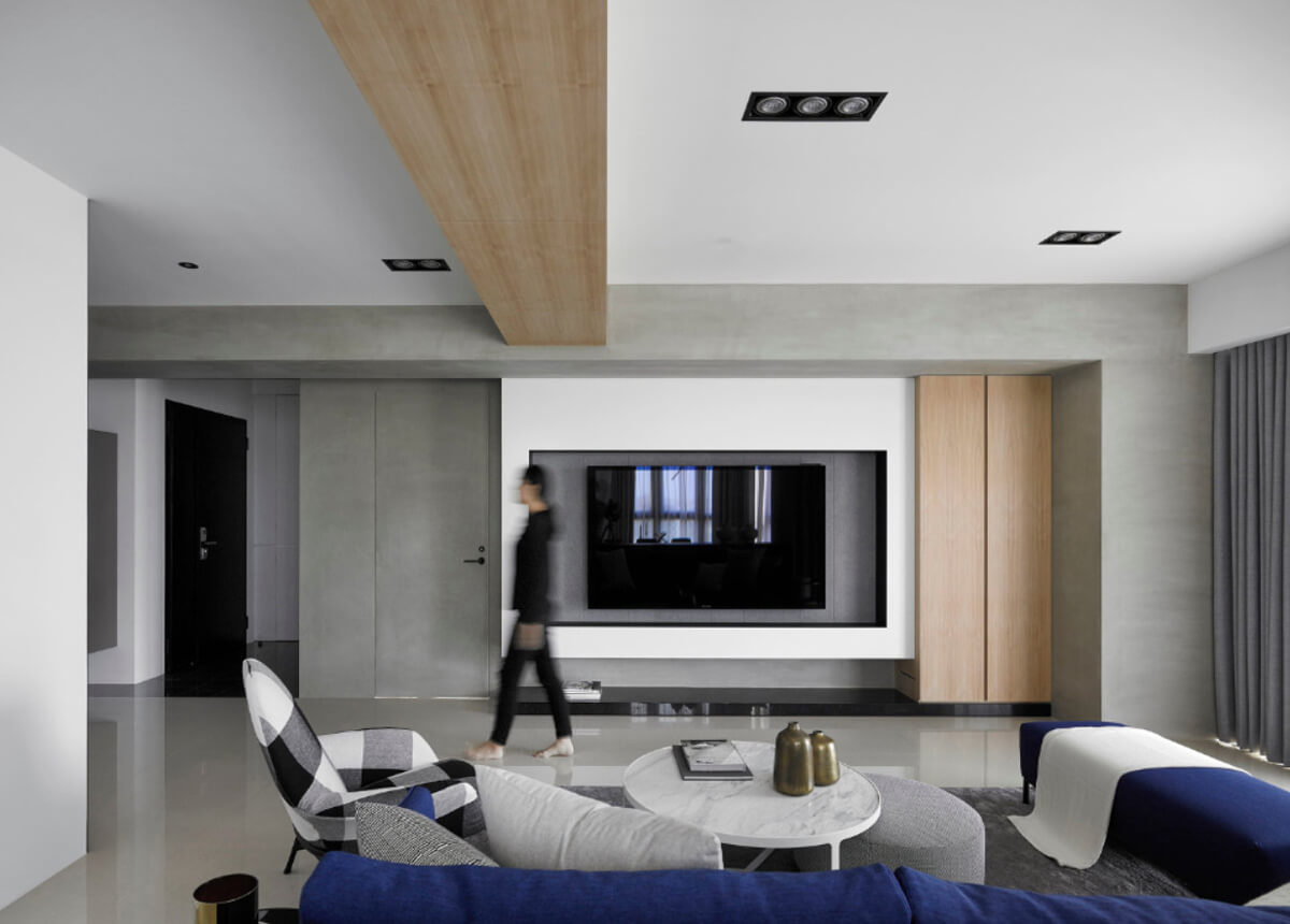 Елегантний дизайн вітальні з великим кутовим диваном і сучасним журнальним столиком.