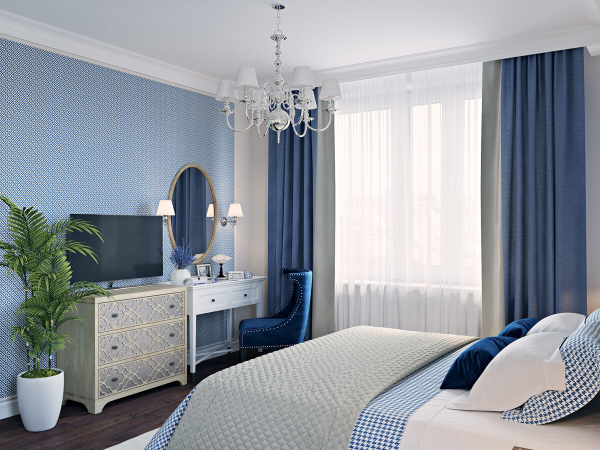 Кухня в синьо-білих тонах: білі шафи, синя плитка та дерев'яна стільниця.