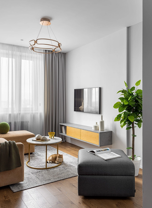 Замалий килим у вітальні: порушення пропорцій та незавершений вигляд зони відпочинку.