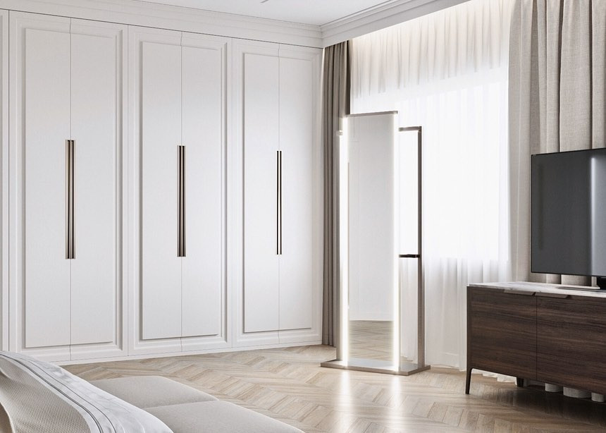 Інтер'єр спальні з білими меблями та акцентом на жовтий колір у деталях декору