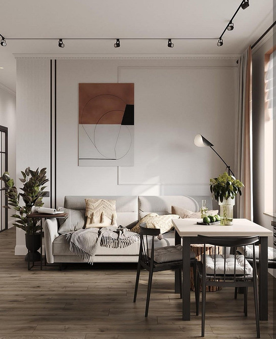 Комфорт білого дивану Елегантний білий диван з подушками в світлій кімнаті. Обираємо комфортний диван 2026.