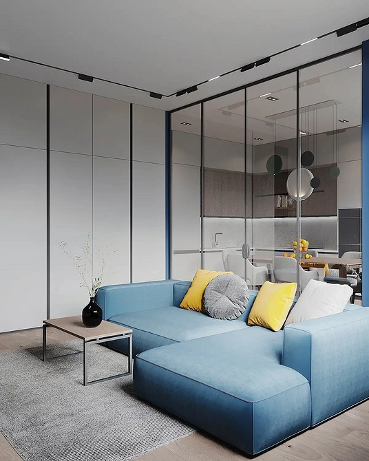 Монохромний диван як стильний акцент у вітальні з сучасним дизайном.