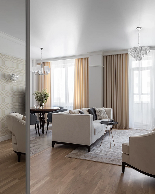 Дизайн вітальні з акцентом на зручний диван, вибір оббивки для стильного інтер'єру.