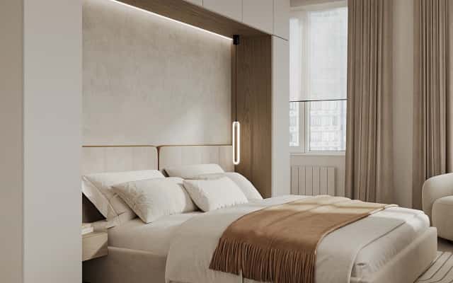 Сучасний інтер'єр балкону, перетвореного на затишну лаунж-зону з м'якими подушками та пледом.