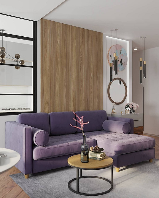 Блакитний диван Блакитний диван у світлій вітальні, створює емоційний колірний акцент.