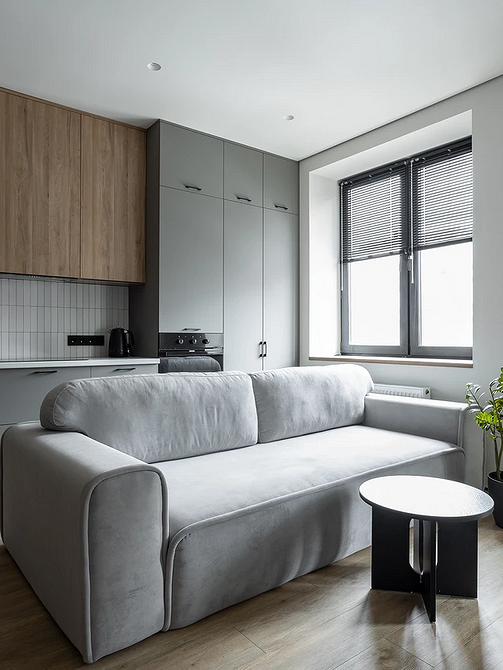 Сучасний дизайн кухні-вітальні: зонування простору та стильна розстановка меблів.