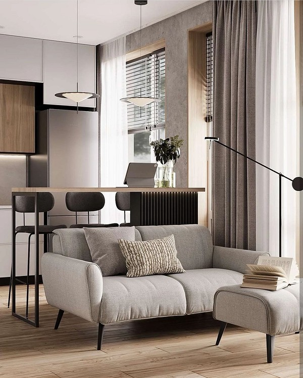 Сучасний диван на ніжках з велюровою оббивкою в мінімалістичній квартирі.