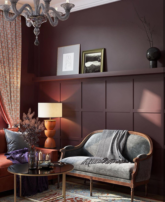 Елегантний диван з підлокітниками на витончених ніжках у світлій вітальні.