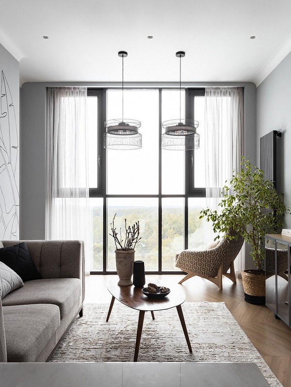 Компактний мінімалізм Двомісний диван на ніжках у невеликій вітальні: мінімалізм 2026