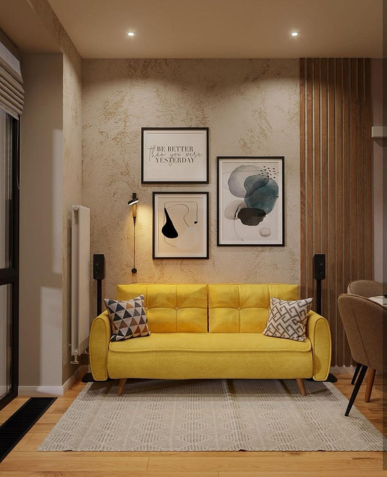 Диван на металевих ніжках в інтер'єрі лофт для сучасної квартири.