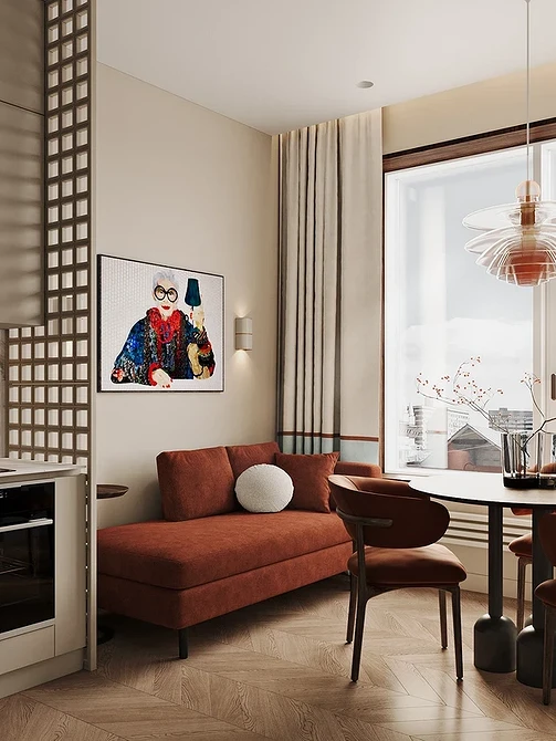 Сучасний коричневий диван з металевими ніжками в світлій кухні, модний акцент