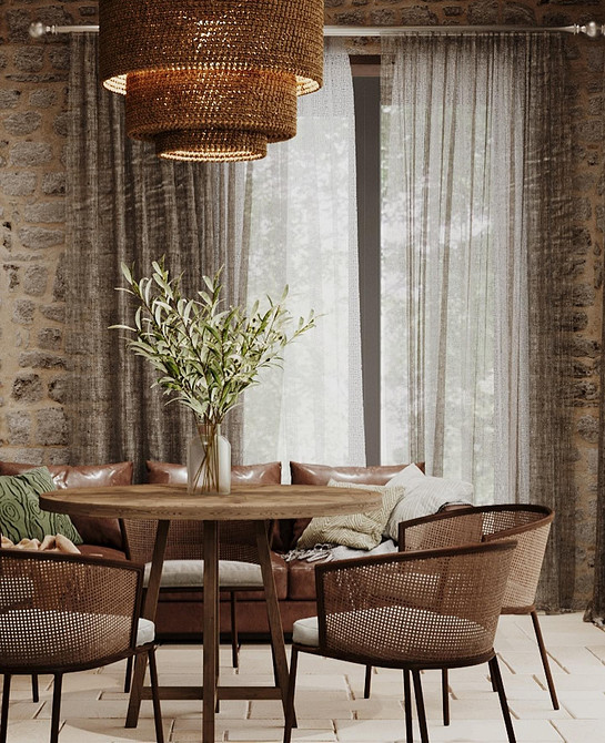 Елегантний шкіряний диван білого кольору у світлій вітальні з рослинами та декором.