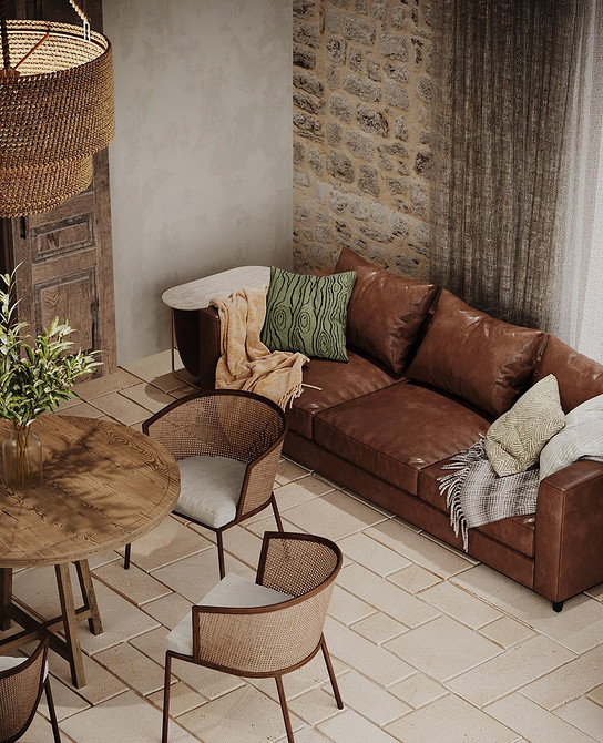 Шкіряний диван з декоративними подушками в інтер'єрі вітальні, додає затишок.