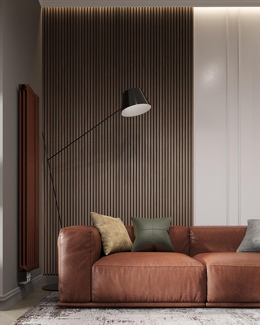 Вітальня з червоним диваном та коричневими меблями, класичне поєднання кольорів у дизайні.