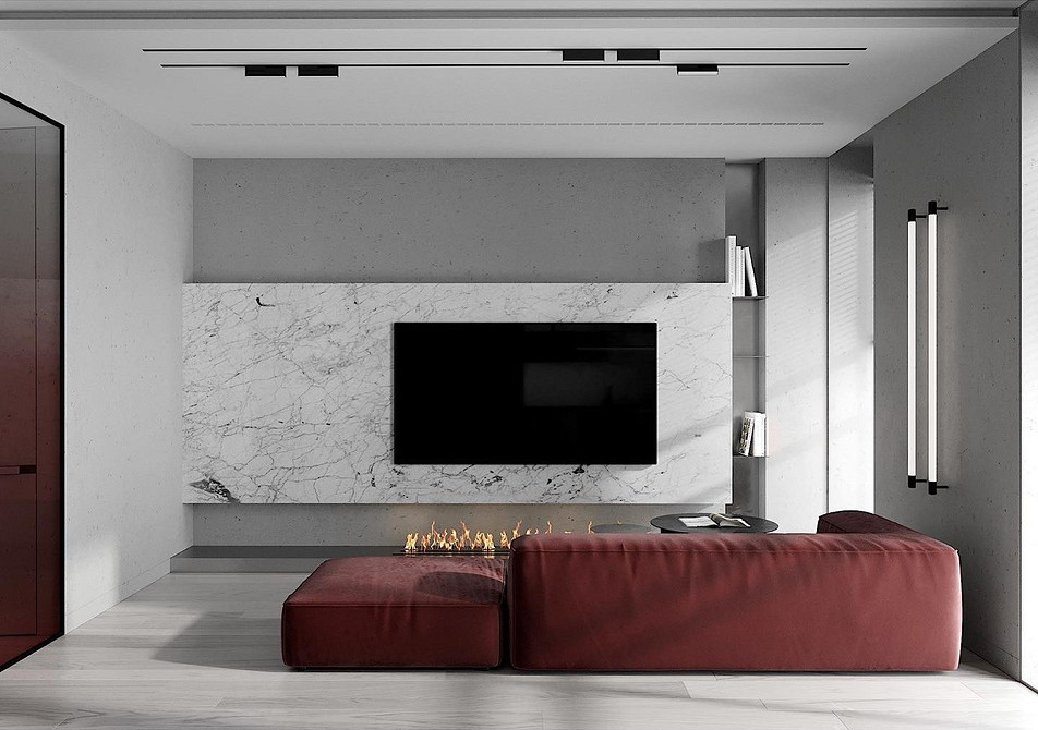 Стильний дизайн вітальні з червоним диваном та яскравими декоративними акцентами