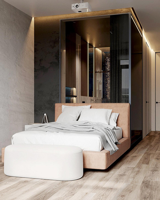 Сучасна спальня з ліжком з м'якою спинкою та декоративними подушками для затишку.