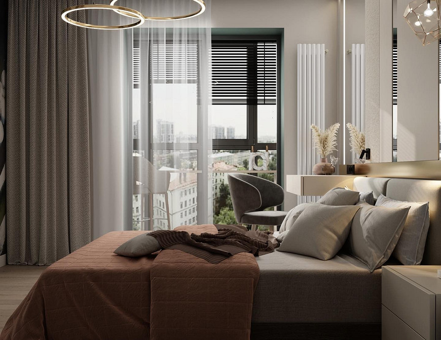 Затишний інтер'єр спальні з високим м'яким узголів'ям, тумбочками та лампами у скандинавському стилі.