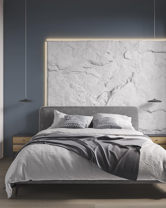 Сучасний інтер'єр спальні з великим ліжком та м'яким узголів'ям для відпочинку.