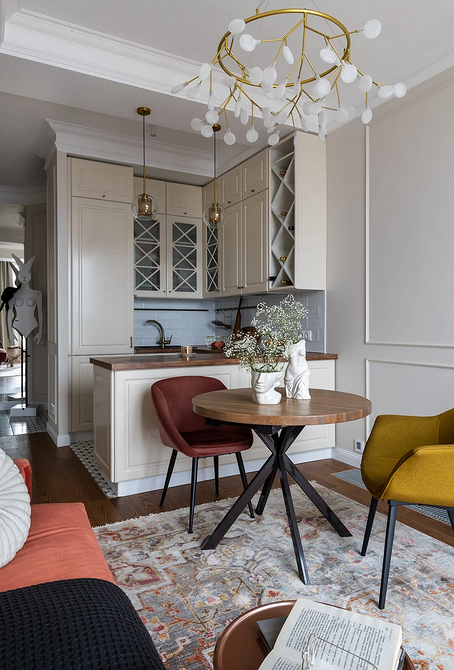 Білий стіл з чорними ніжками Елегантний обідній круглий стіл з білою стільницею та чорними ніжками 2026.