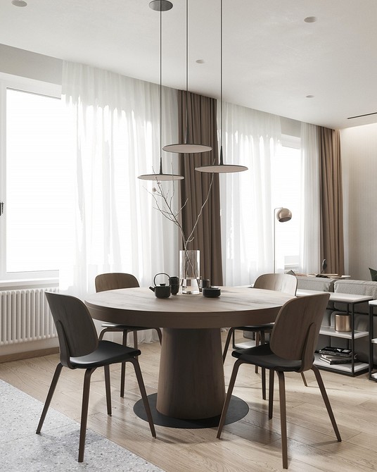 Круглий стіл: збираємось разом Стильний круглий обідній стіл у світлій вітальні, чудове рішення для сімейних зустрічей.