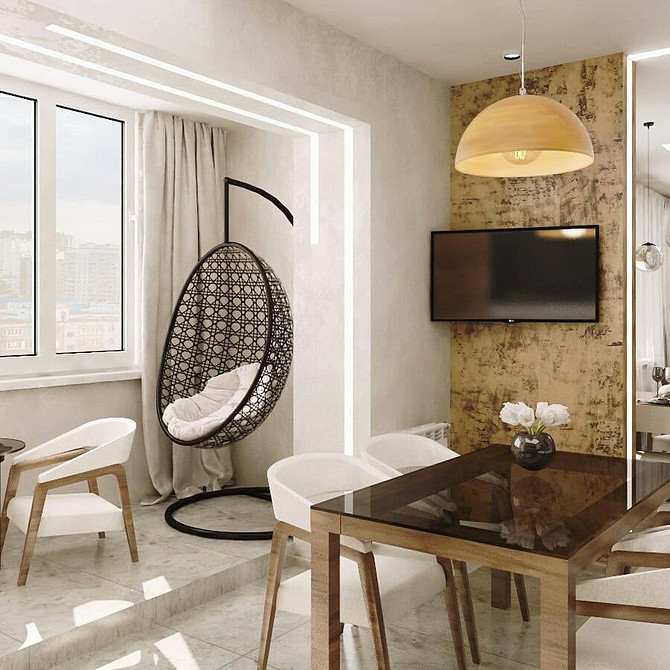 Кругле підвісне крісло в скандинавському інтер'єрі: стильний дизайн для затишної квартири.