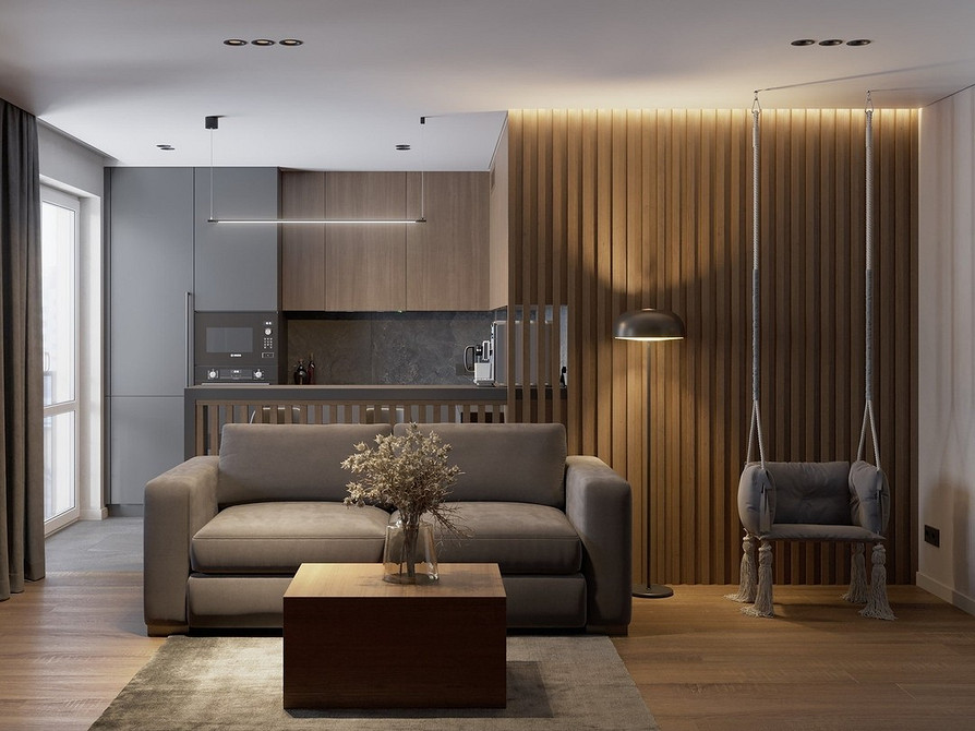 Підвісне крісло з ротангу в інтер'єрі, екологічний дизайн для зони релаксу.