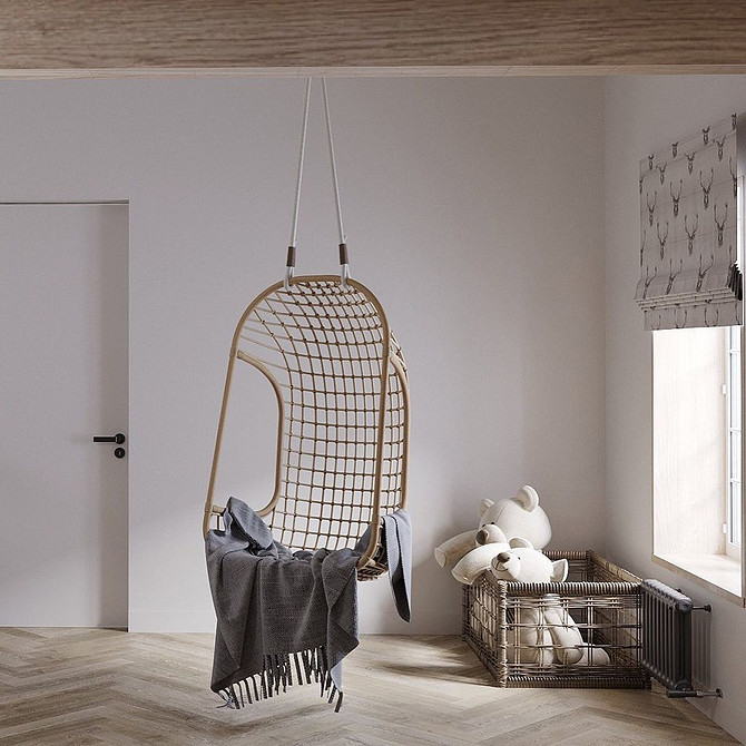 Підвісне крісло кокон у світлому інтер'єрі: затишне місце для відпочинку вдома.