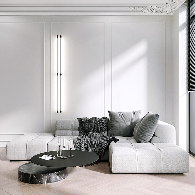Стильний акцент Стильний ахроматичний диван з акцентними подушками, що підкреслюють мінімалістичний дизайн інтер'єру.