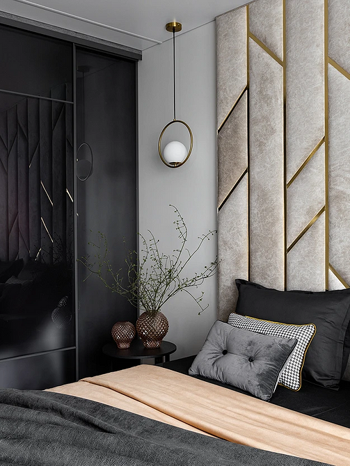 Мінімалістична спальня з сірим ліжком та білими стінами, дерев'яна підлога.