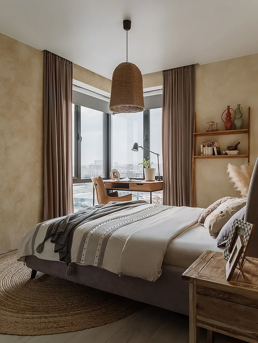 Сірий Шарм Елегантна спальня в сірих відтінках з килимом та сірим ліжком.