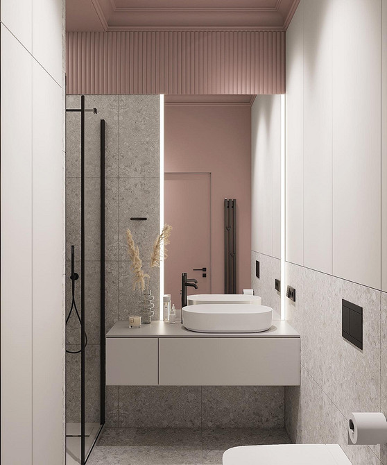 Сіра плитка та меблі Елегантний дизайн ванної кімнати: сіра плитка, сіра тумба під раковину та сучасне дзеркало.