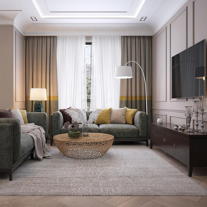 Інтер'єр вітальні з сірим диваном, дерев'яною підлогою та яскравими акцентами в декорі.