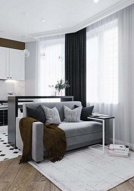 Сірий модульний диван 2026 з дерев'яним журнальним столиком у мінімалістичному інтер'єрі.