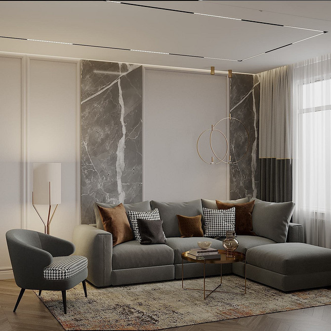 Поєднання кольорів у вітальні: сірий диван, килим та декор для затишку