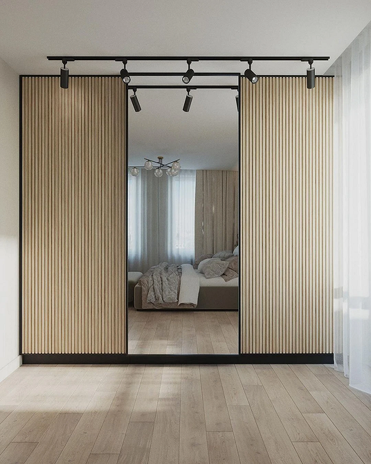 Вбудована шафа-купе, ергономічне рішення для оптимізації простору в спальні.