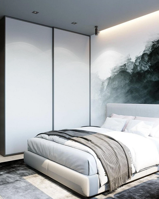 Сучасна шафа-купе в світлих тонах, мінімалістичний дизайн інтер'єру спальні.