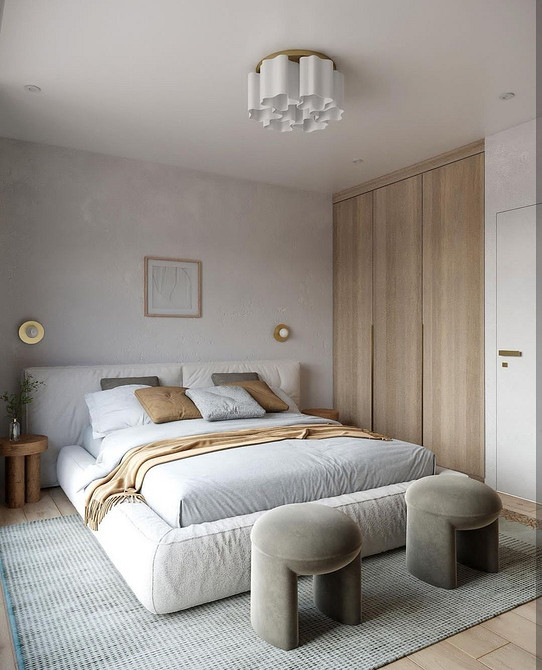 Біла шафа-купе в спальні з мінімалістичним дизайном, що підходить до будь-якого інтер'єру.