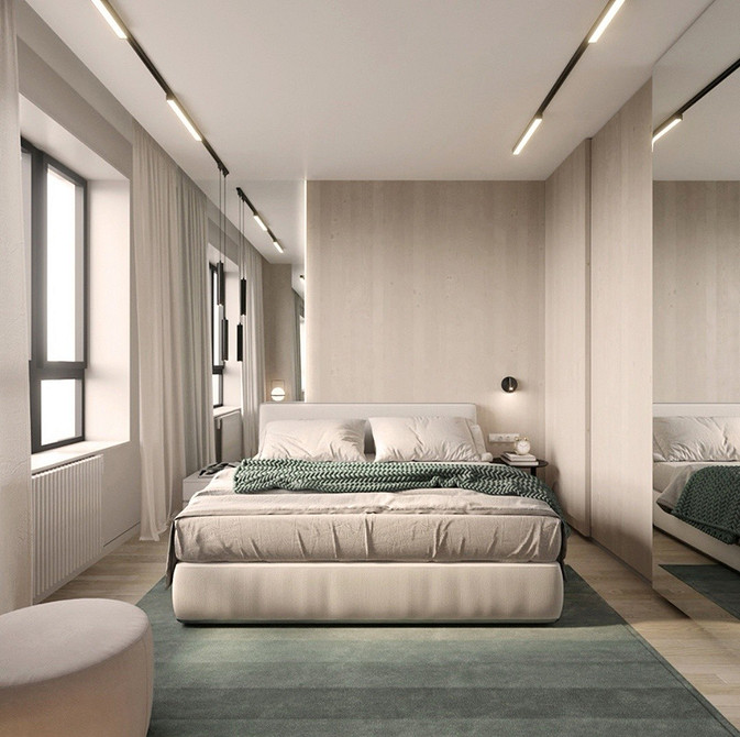 Сучасний дизайн шафи-купе з дзеркальними фасадами для світлої спальні.