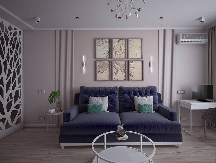 Інтер'єр в сучасному стилі з синім диваном, журнальним столиком та декором.