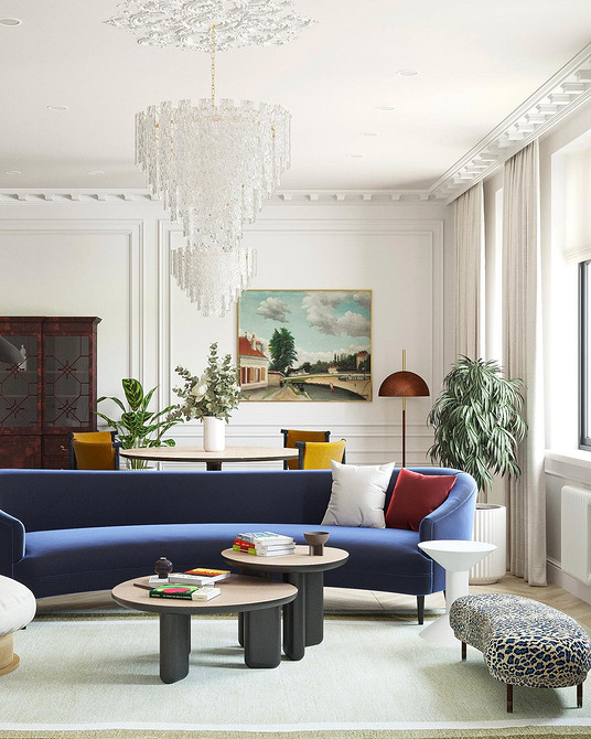 Інтер'єр з синім диваном та книжковою шафою: затишний куточок для читання вдома.