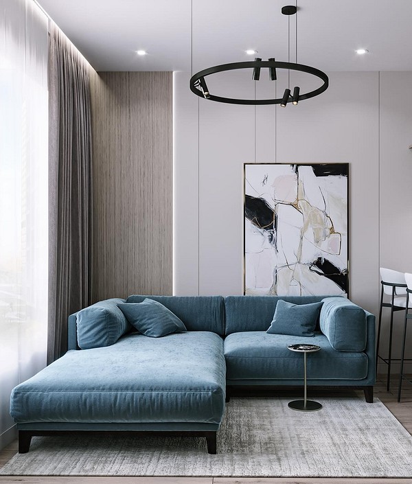 Сучасний інтер'єр з синім диваном: поєднання кольорів та стильні меблі для дому.