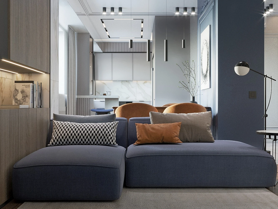 Синій диван в скандинавському стилі з дерев'яними ніжками у вітальні