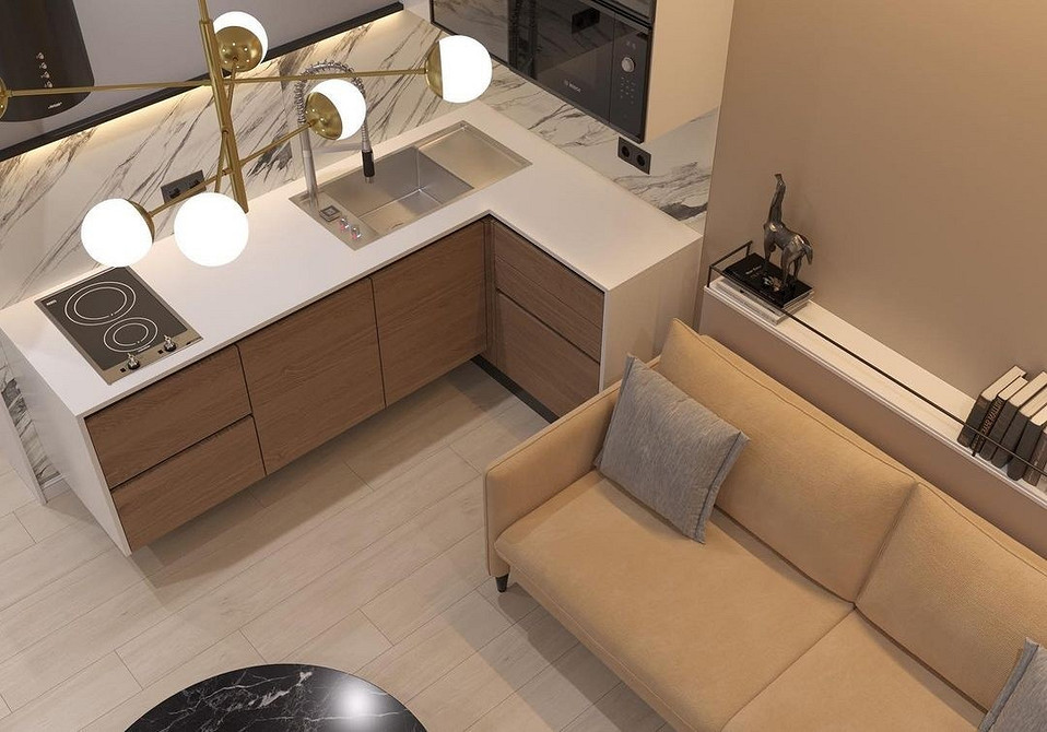 Оптимізована невелика кухня з кутовим диваном: зручність та використання простору.