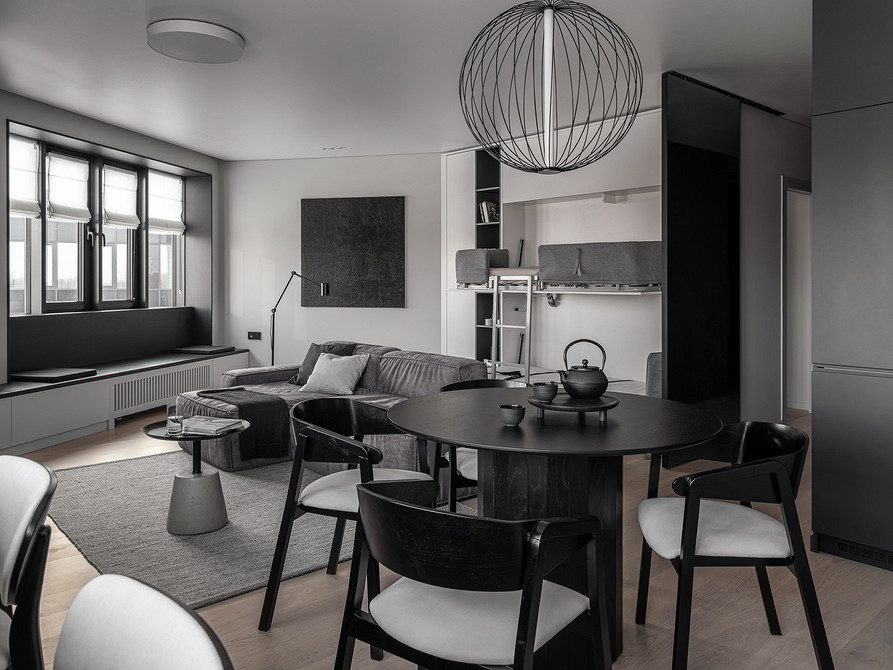 Кухня-вітальня з кутовим диваном зонує простір і додає комфорту в 2026.