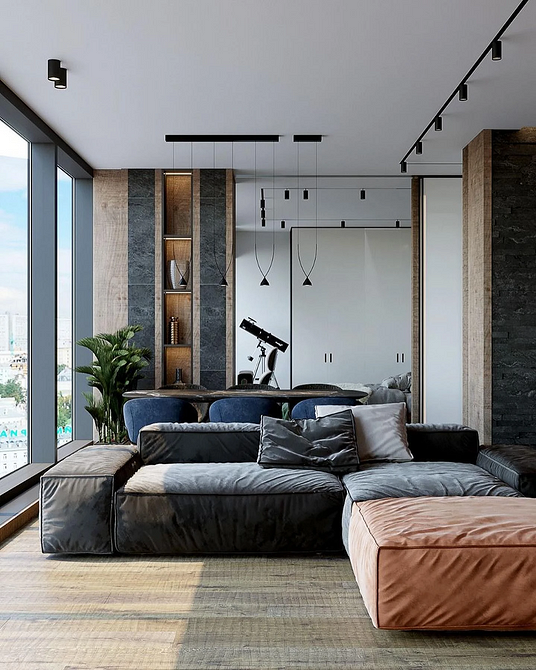 Затишний кутовий диван з дерев'яними ніжками у вітальні з килимом, комфорт та стиль.