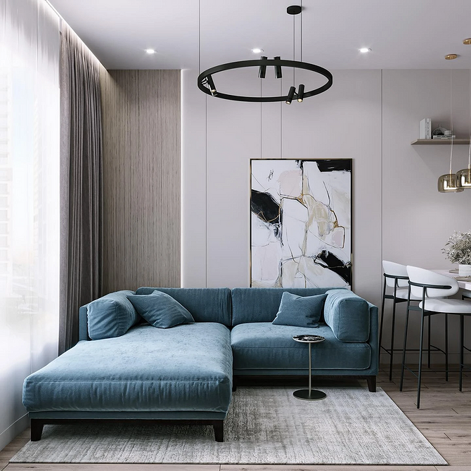 Кутовий диван з великою кількістю подушок у світлому інтер'єрі, чудове рішення для відпочинку.