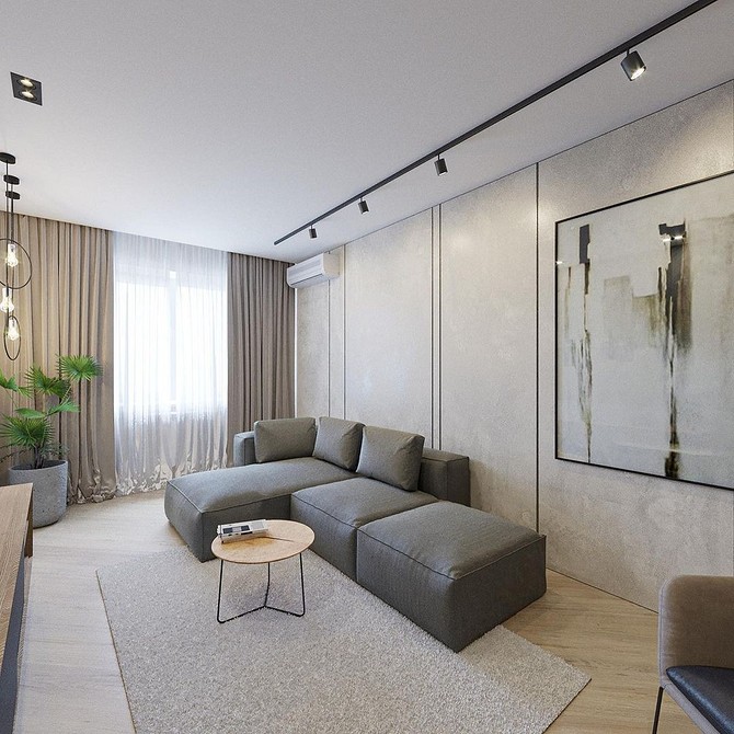 Кутовий диван з бежевою оббивкою в інтер'єрі вітальні в стилі мінімалізм.