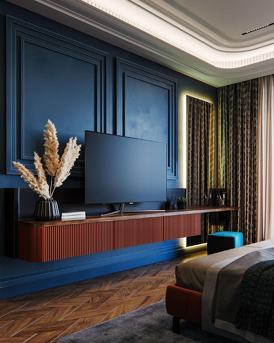 Кутова тумба під телевізор для маленької вітальні, економія простору.